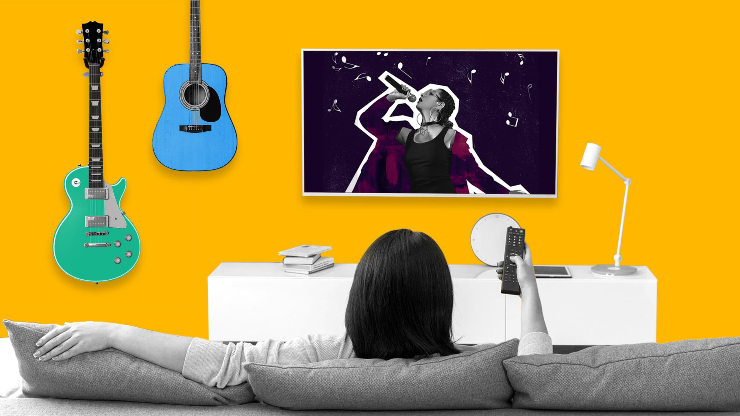 This image features someone watching TV while sitting on their couch. On their wall, you'll find two different guitars. On their TV, you can see video content of someone performing in a concert. This image represents how addressable TV can help you reach the right audience.